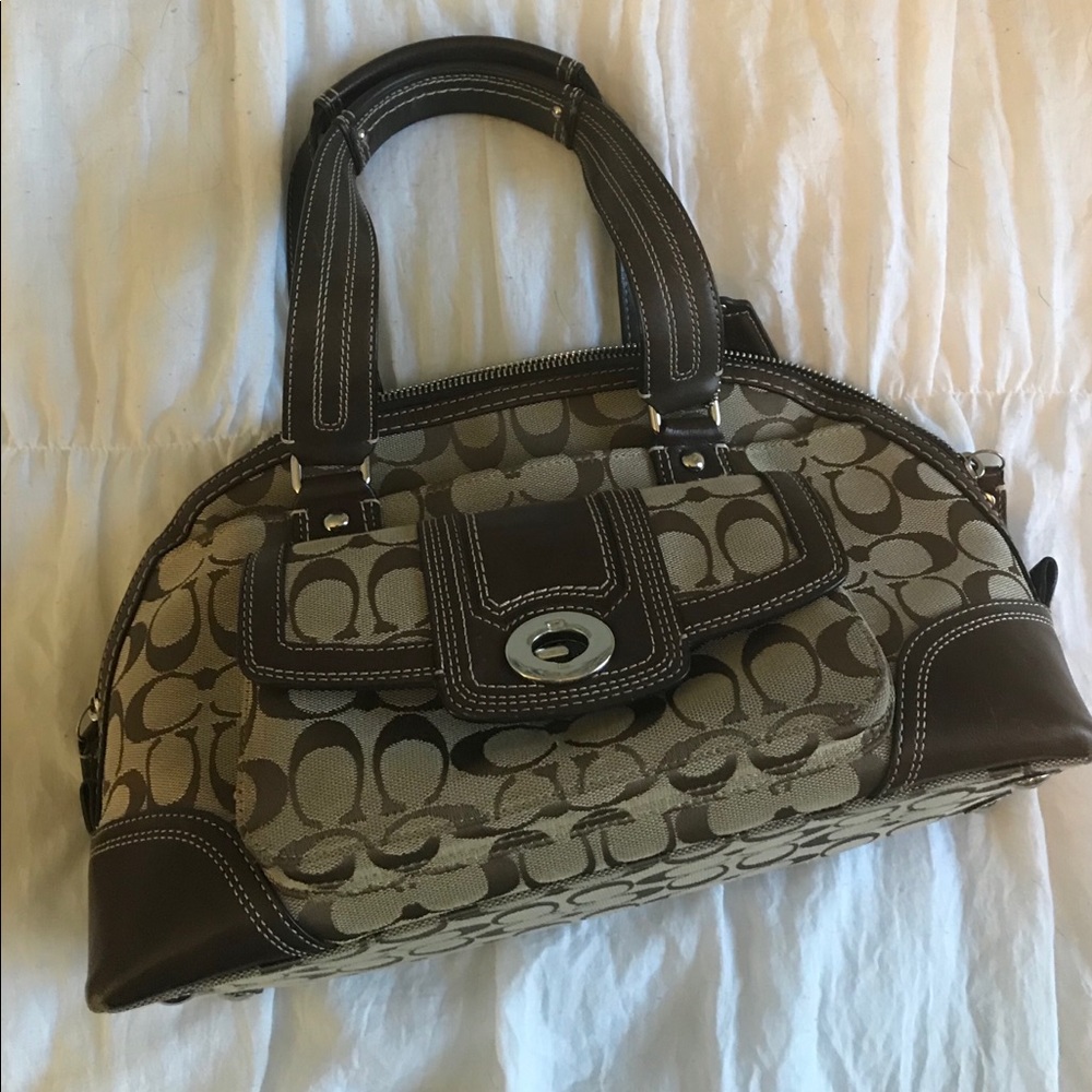 Brown Coach purse with signature jacquard 5x13x8.